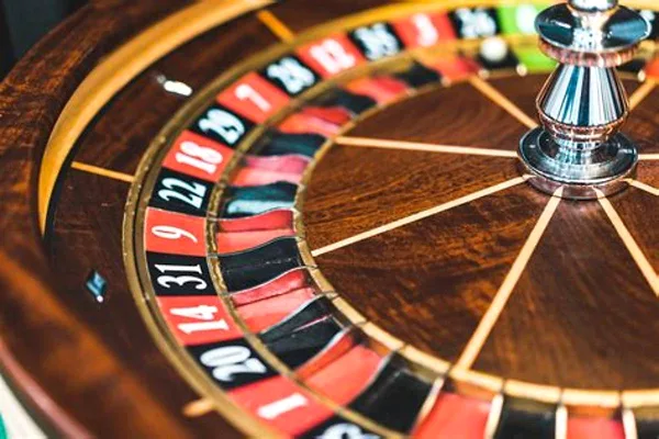 Roulette wheel spinning at an online casino table
